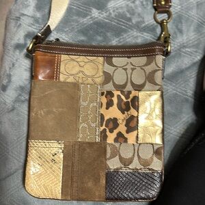 Small coach multi color bag.